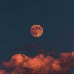 full moon with fluffy clouds - spooky sky 