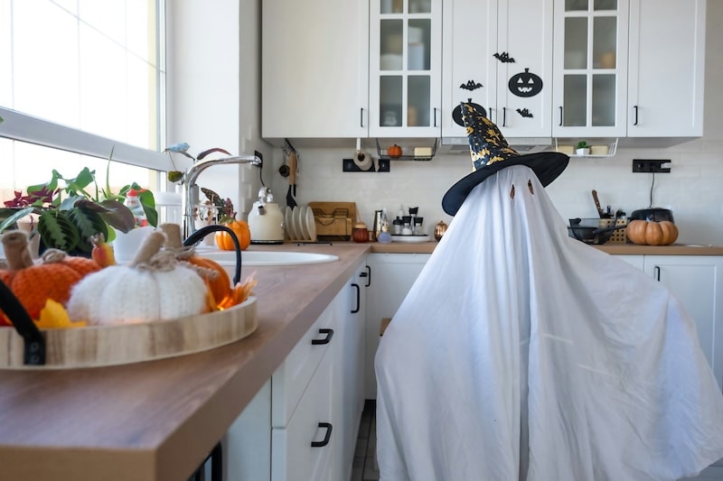 child dressed up as a ghost for Halloween