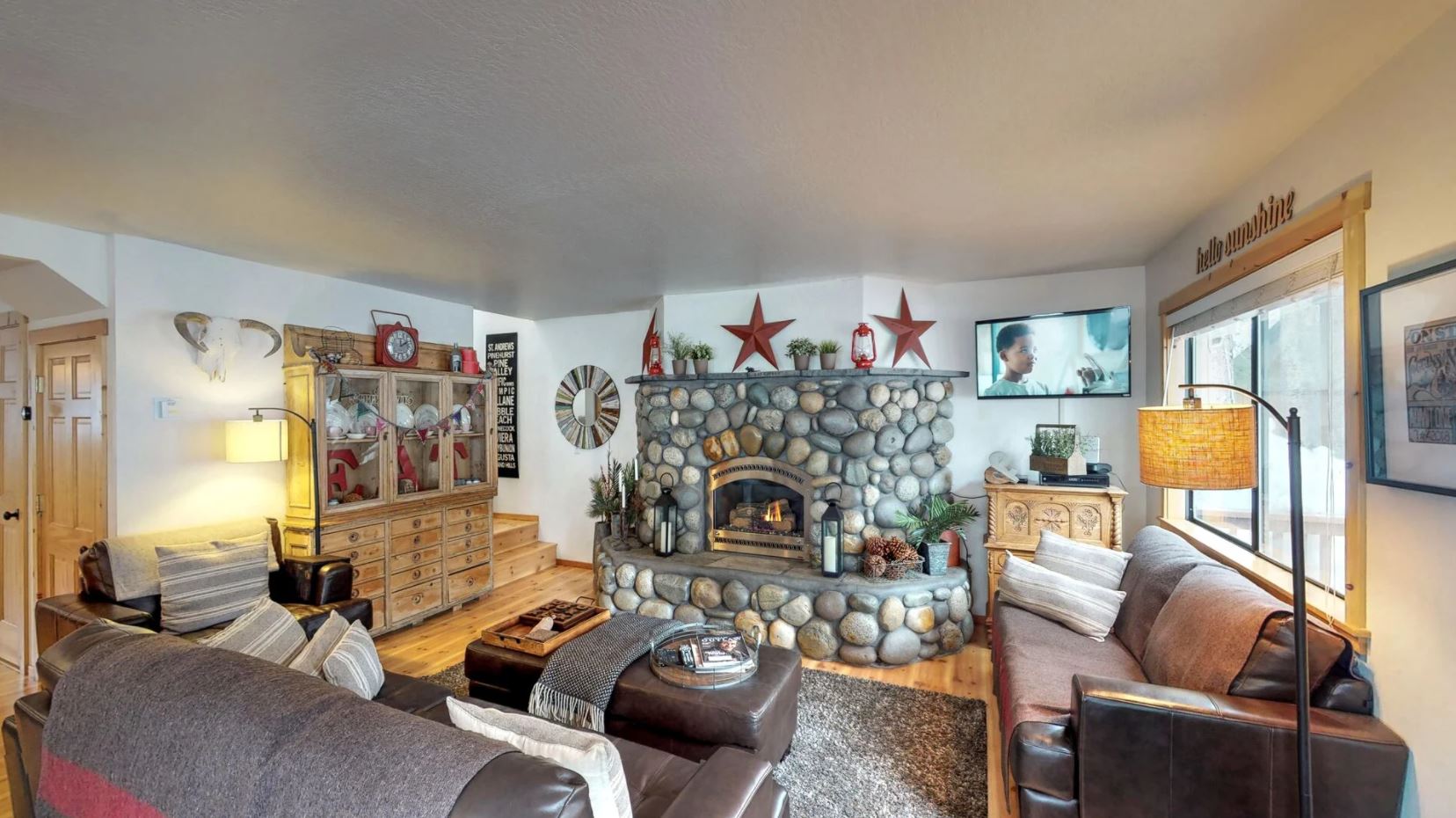 The fireplace centered in one of our Beautiful Truckee Cabin Rental living rooms