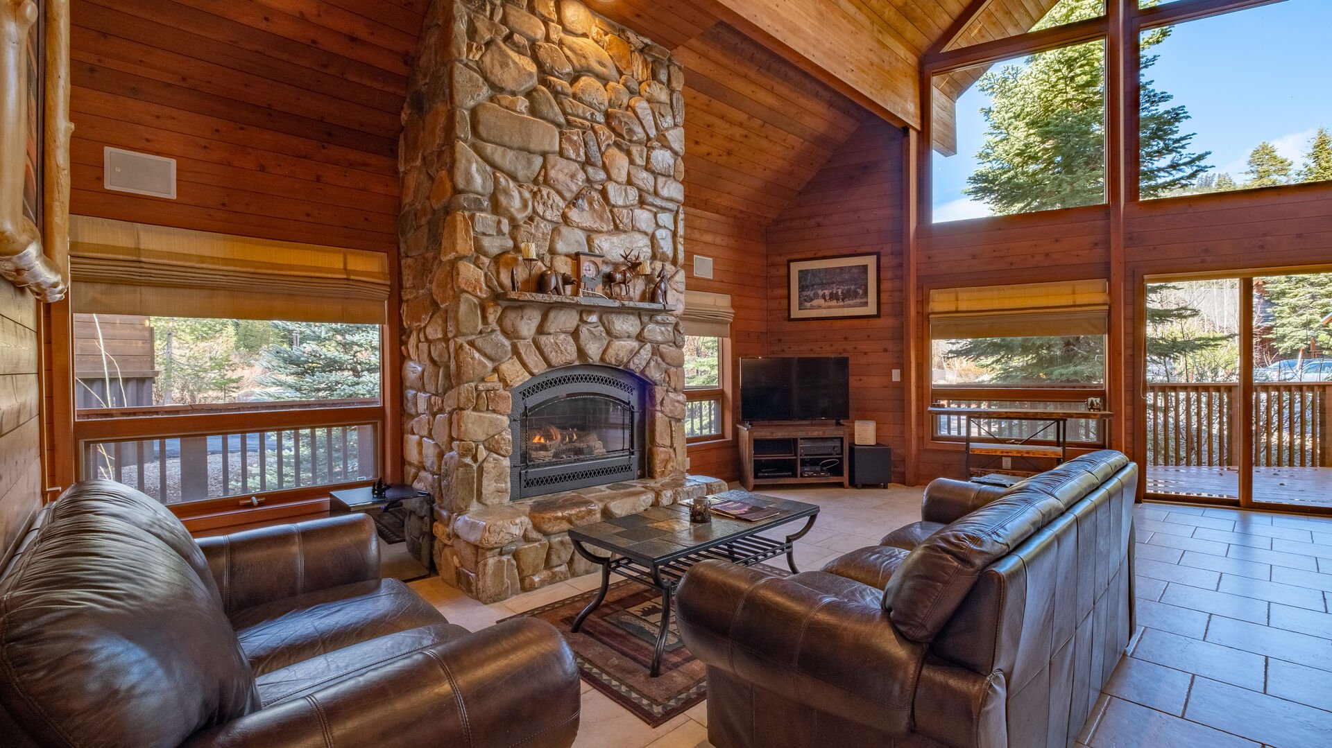 The fireplace of a Truckee Vacation Rental with couches in front