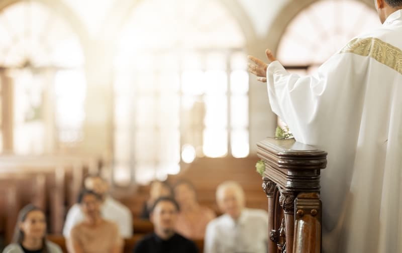 Congregation, religion and faith with leader, in church and preaching sermon, speaking and spiritua.