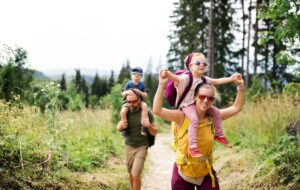 family hiking through an alpine meadow - North Lake Tahoe travel itinerary