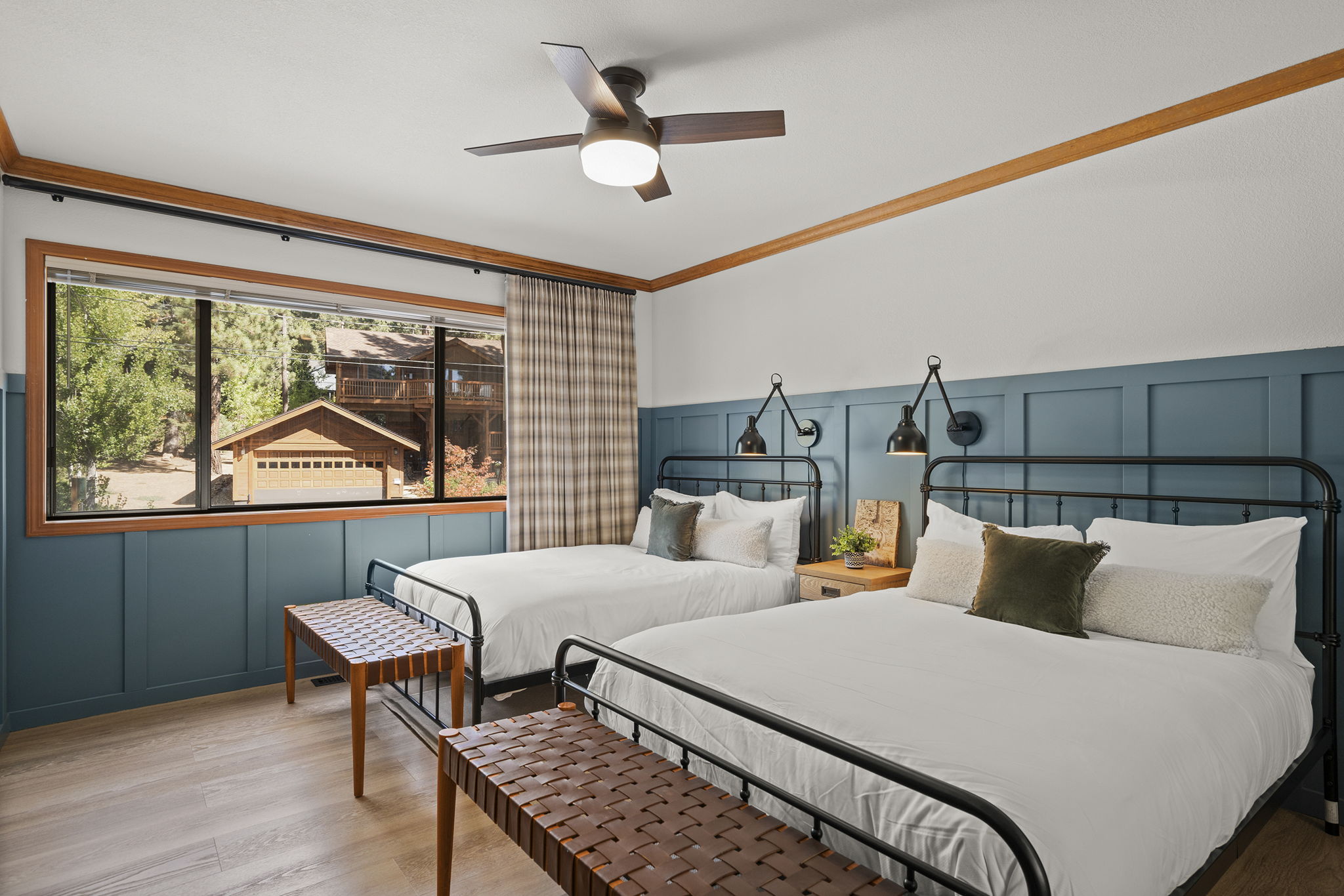 two double beds in a vacation rental bedroom - bright welcoming space