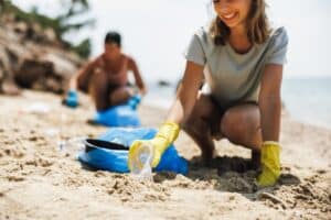people cleaning up the beach - labor day cleanup 