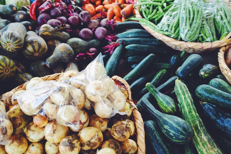 lots of fresh vegetables at a farm market