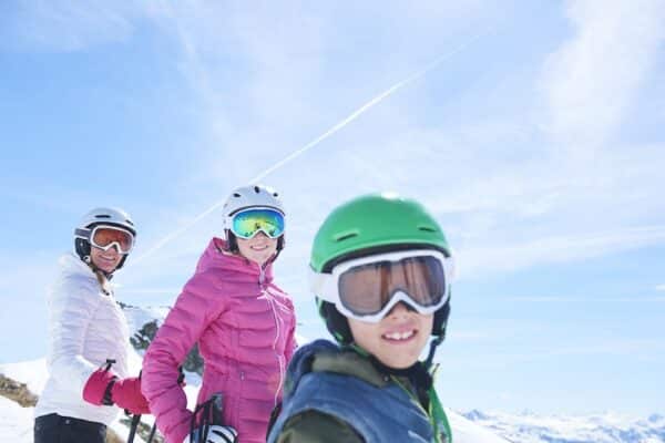 Mother, daughter and son on skiing holiday - spring break, spring skiing, family skiing