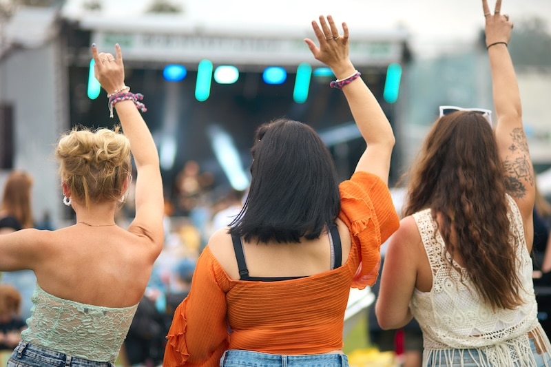 Rear View Of Three Female Friends Dancing At Summer Music Festival - concert outdoor