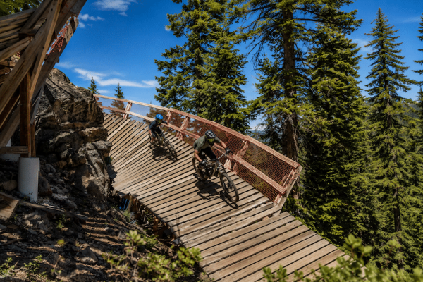 adult and child riding on one of Northstar California's bike park trails